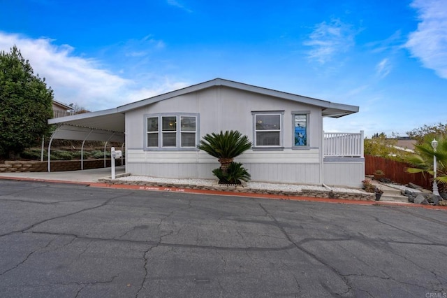 view of home's exterior featuring a carport