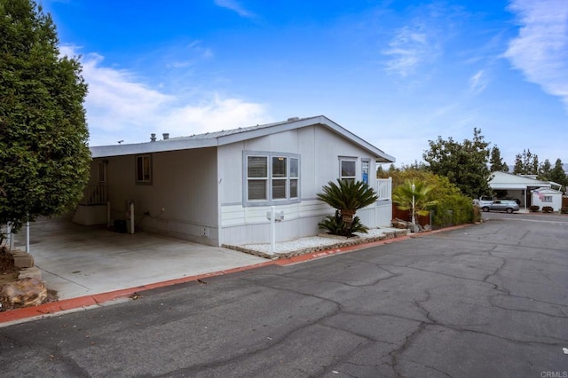 exterior space with a carport