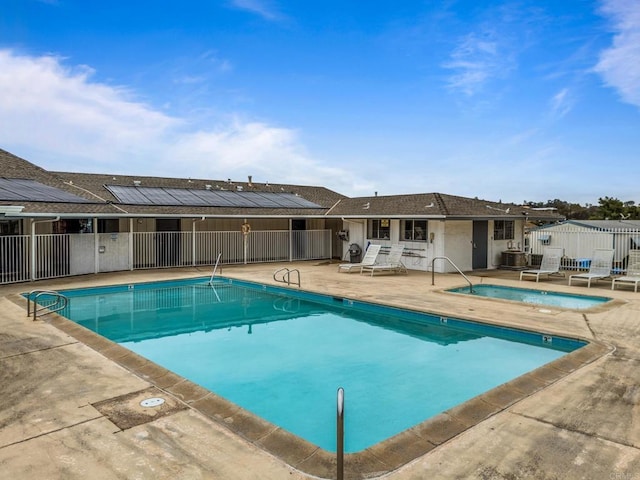 view of pool featuring central AC unit and a patio