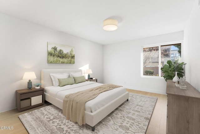 bedroom with light wood-type flooring