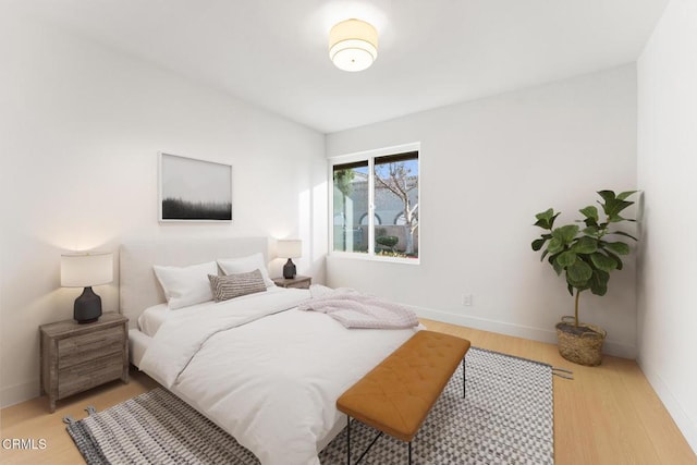 bedroom with light wood-type flooring