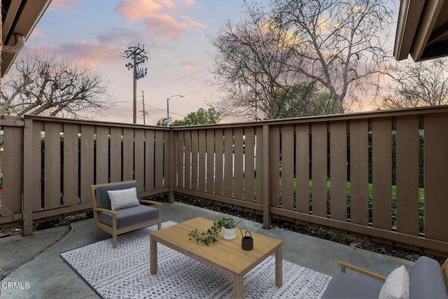 view of patio terrace at dusk