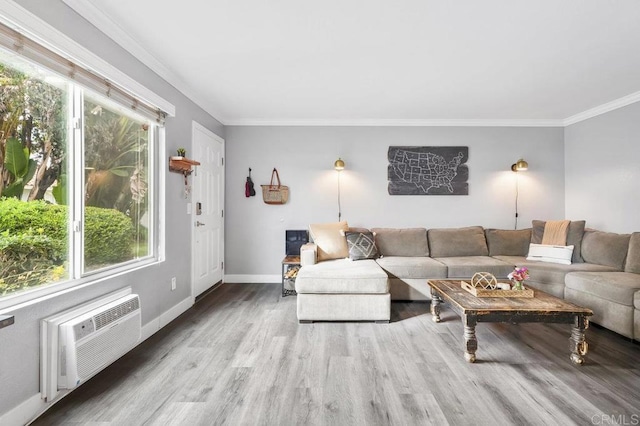 living room with hardwood / wood-style floors, ornamental molding, and a wall mounted AC