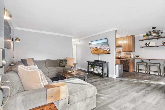 living room with hardwood / wood-style floors and ornamental molding