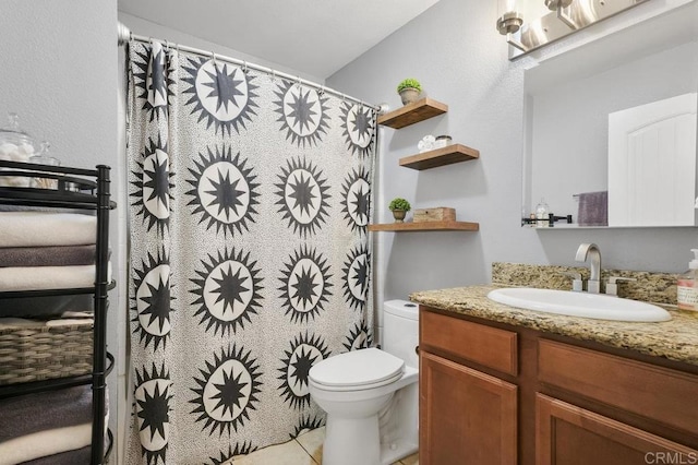 bathroom with toilet, tile patterned floors, a shower with shower curtain, and vanity