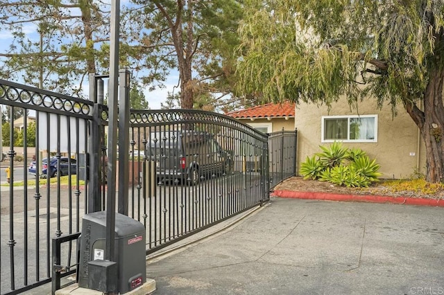 view of gate featuring fence