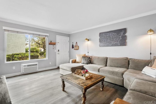 living room with baseboards, wood finished floors, crown molding, and a wall mounted AC