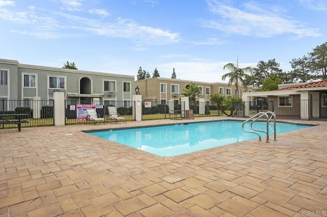 community pool featuring fence