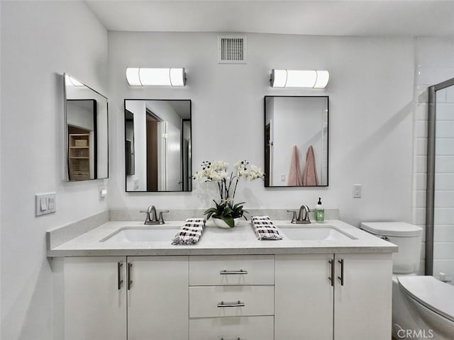1137 Tiffany Cir S, Palm Springs, CA 92262 - bathroom featuring double vanity, toilet, and an enclosed shower