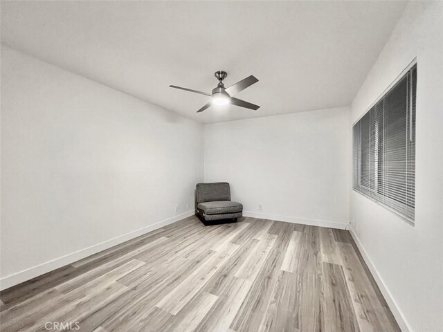 1137 Tiffany Cir S, Palm Springs, CA 92262 - unfurnished room with wood finished floors, ceiling fan, and baseboards