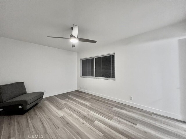 1137 Tiffany Cir S, Palm Springs, CA 92262 - unfurnished room with wood finished floors, a ceiling fan, and baseboards