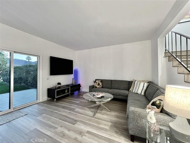 1137 Tiffany Cir S, Palm Springs, CA 92262 - living area with wood finished floors, stairs, and baseboards