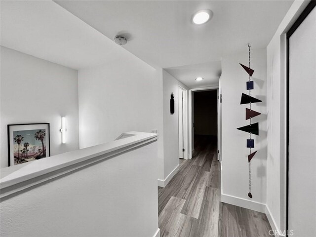 1137 Tiffany Cir S, Palm Springs, CA 92262 - hallway with baseboards, wood finished floors, recessed lighting, and an upstairs landing