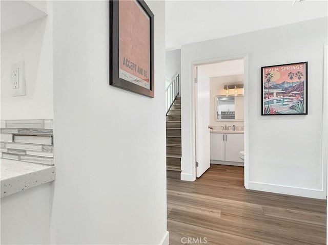 1137 Tiffany Cir S, Palm Springs, CA 92262 - hallway with stairway and light wood finished floors