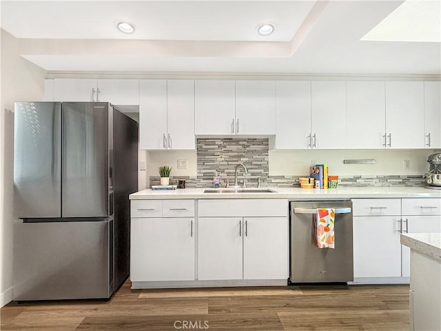 1137 Tiffany Cir S, Palm Springs, CA 92262 - kitchen featuring stainless steel appliances, recessed lighting, white cabinetry, light countertops, and tasteful backsplash