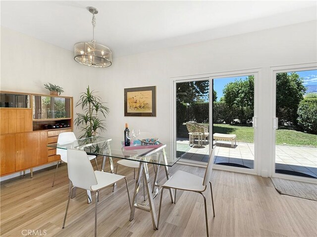 1137 Tiffany Cir S, Palm Springs, CA 92262 - dining room with light wood-style flooring and a chandelier