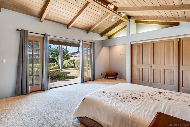 carpeted bedroom with vaulted ceiling with beams, access to exterior, track lighting, wooden ceiling, and a closet