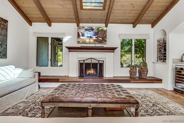 living room with lofted ceiling with beams, beverage cooler, and wood ceiling