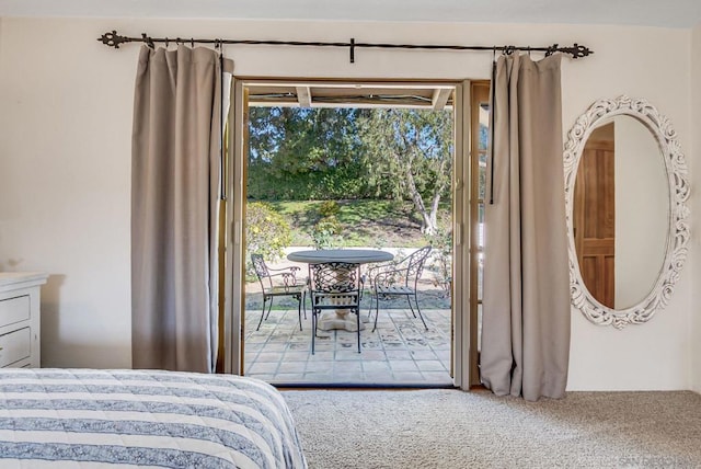 carpeted bedroom featuring access to exterior