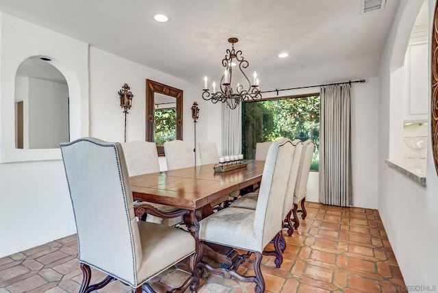 dining room featuring a notable chandelier and plenty of natural light