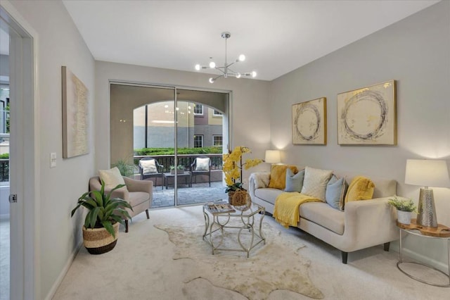 living room featuring carpet flooring and a notable chandelier