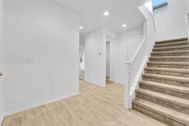 stairway featuring hardwood / wood-style floors