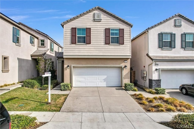 view of front property with a garage and a front lawn