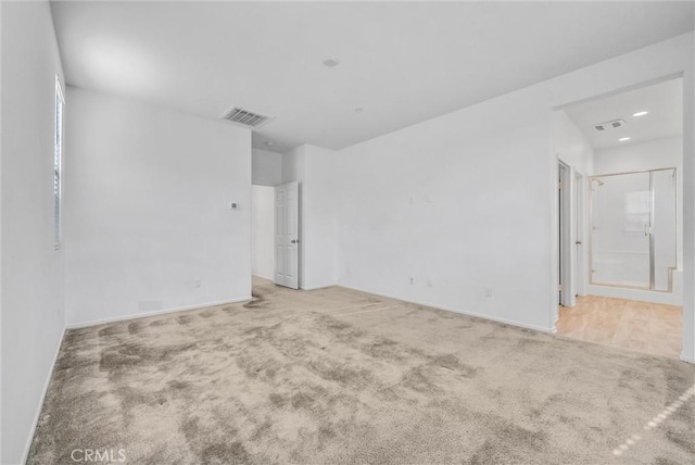 unfurnished room featuring carpet