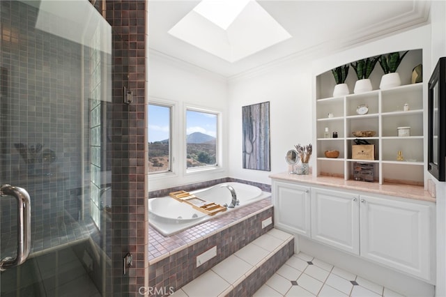 bathroom featuring a mountain view, crown molding, a skylight, and shower with separate bathtub