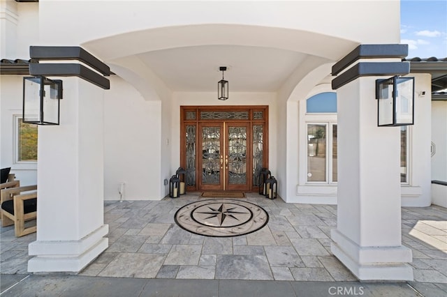 entrance to property featuring french doors