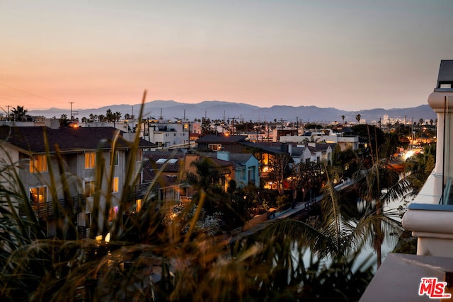 property's view of city with a mountain view