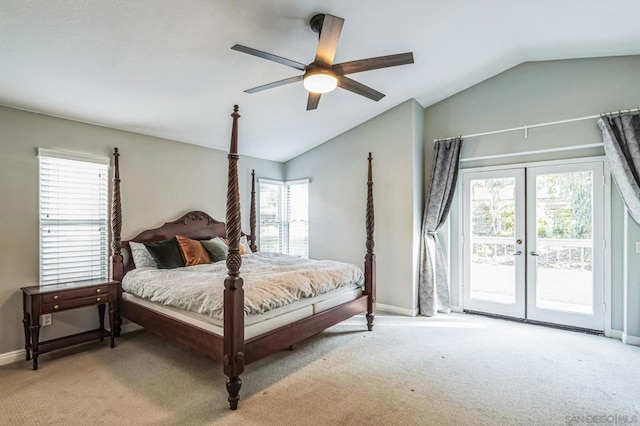 carpeted bedroom with lofted ceiling, multiple windows, and access to outside