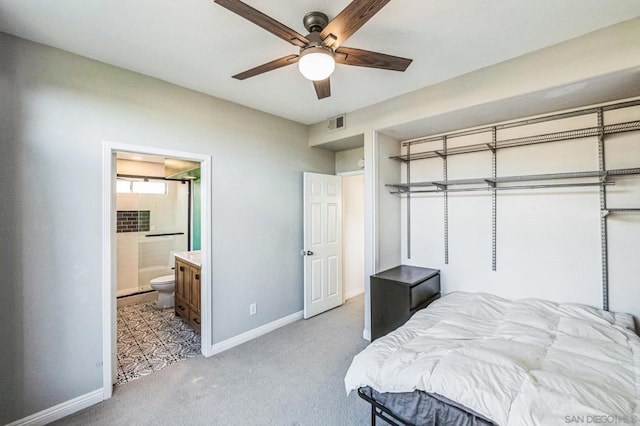 carpeted bedroom with connected bathroom