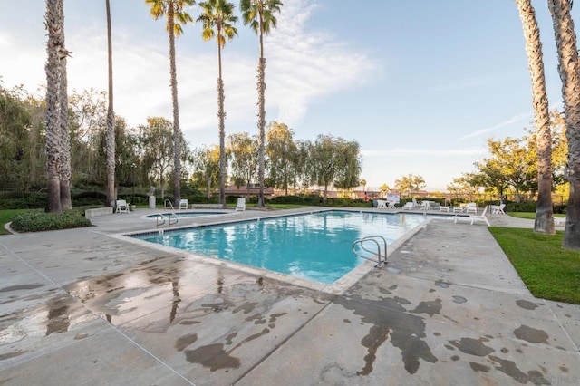 view of pool featuring a patio area