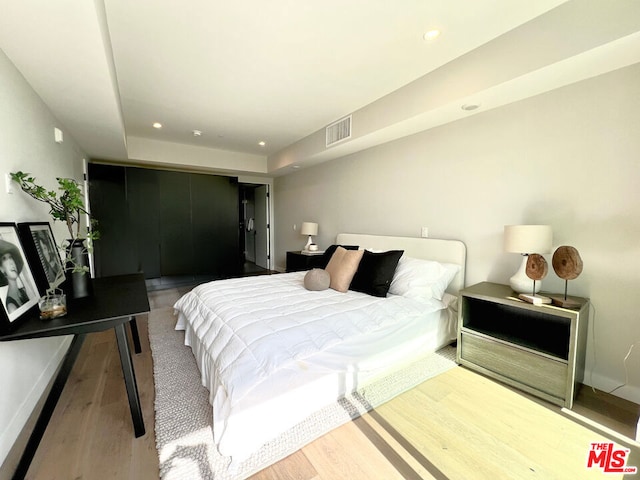 bedroom featuring hardwood / wood-style floors