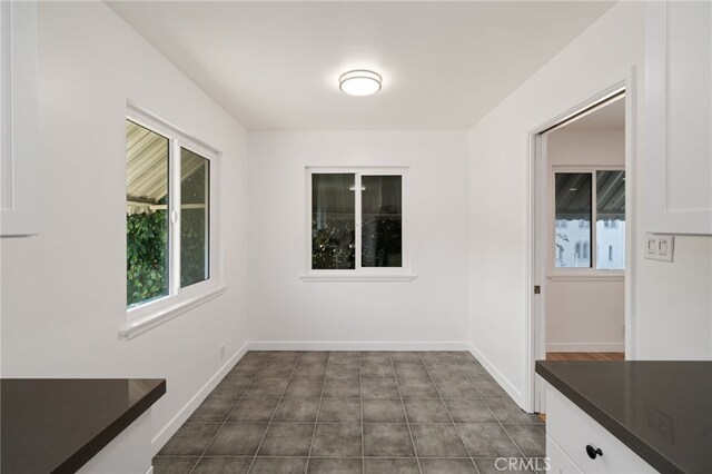 734 Linden Ave Unit 7, Long Beach, CA 90813 - unfurnished dining area featuring baseboards