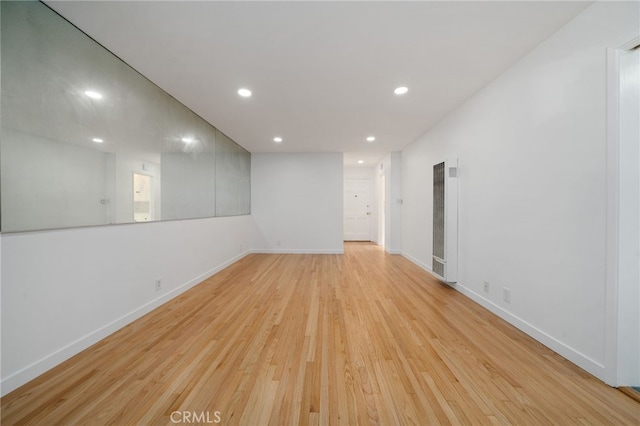 734 Linden Ave Unit 7, Long Beach, CA 90813 - unfurnished room featuring a heating unit, recessed lighting, and light wood-style floors