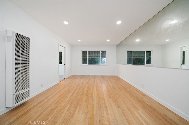 734 Linden Ave Unit 7, Long Beach, CA 90813 - unfurnished room with a heating unit, wood finished floors, and recessed lighting