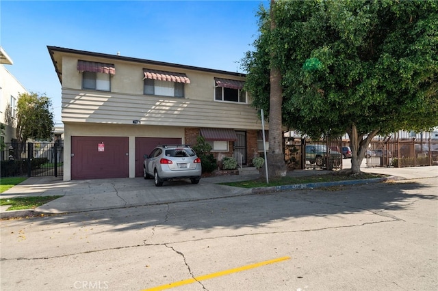 734 Linden Ave Unit 7, Long Beach, CA 90813 - multi unit property with stucco siding, a garage, driveway, and brick siding