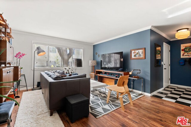 living room with hardwood / wood-style flooring and ornamental molding