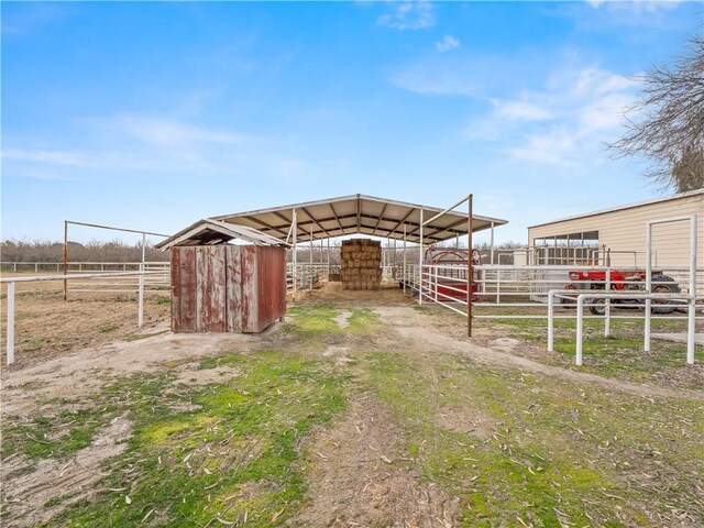 view of outbuilding featuring a rural view