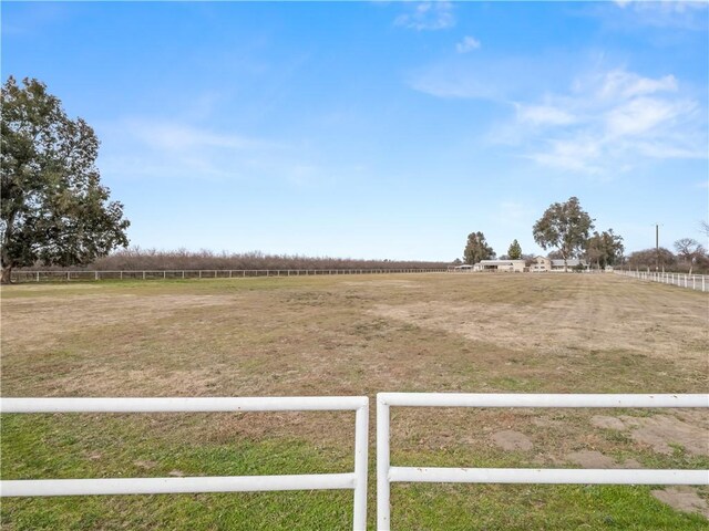 view of yard with a rural view