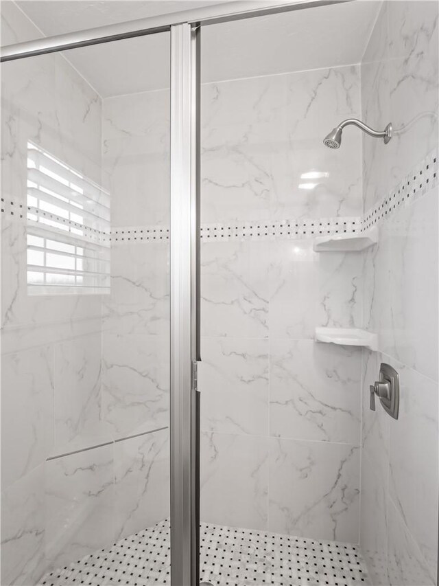 bathroom featuring an enclosed shower