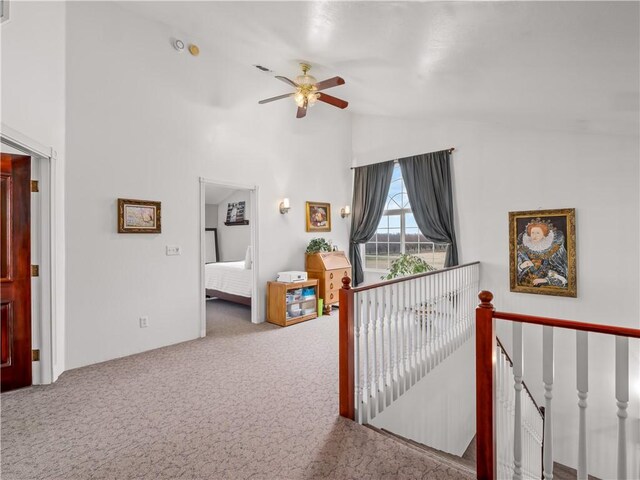 hall with lofted ceiling and carpet flooring