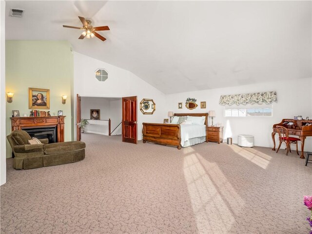 carpeted bedroom featuring high vaulted ceiling and ceiling fan