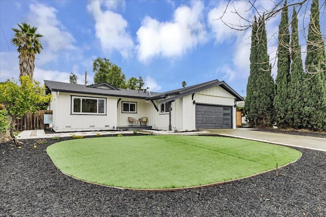 single story home with a garage and a front lawn