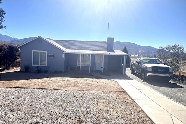 view of front of home with a mountain view