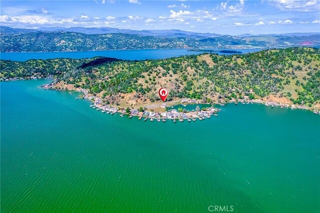 bird's eye view with a water and mountain view