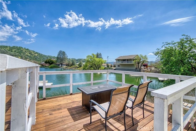 deck featuring a water view