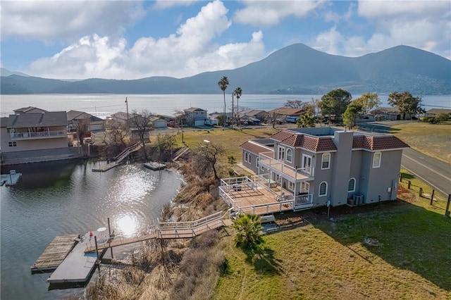 bird's eye view with a water and mountain view